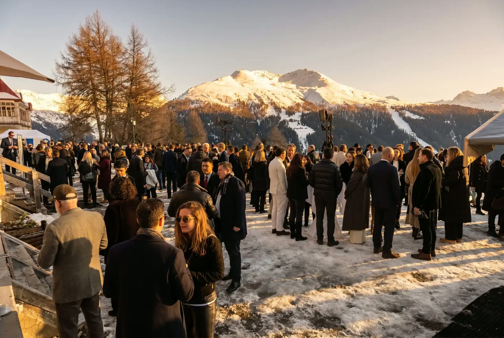 Participants and guests gathered outdoors in Davos at sunset